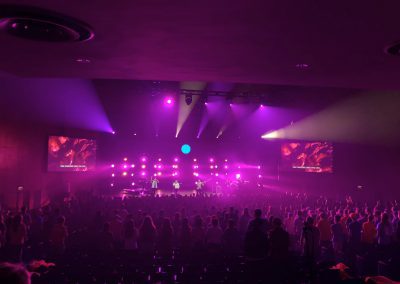 pink neon lights on stage during worship service