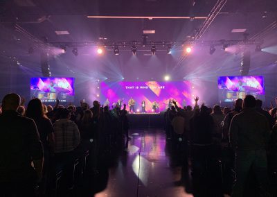 pink stage lighting during a church worship service